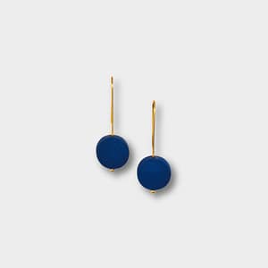 An elegant set of gold earrings with a Blue polymer clay bead